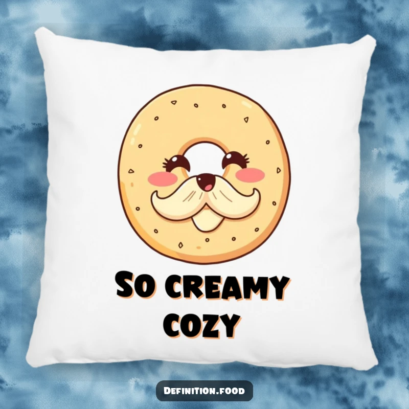 Funny pillow featuring a smiling bagel character with a cream cheese mustache, offering plush comfort and a delightful dose of breakfast humor.