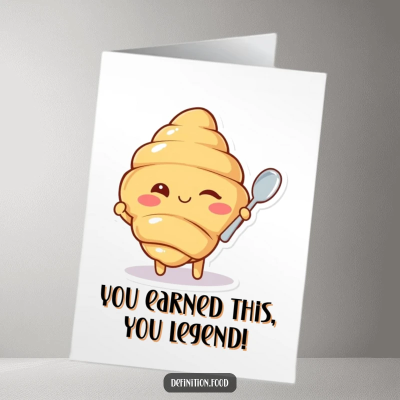Free Printable congratulations card showcasing a winking croissant character offering a tiny spoon, perfect for celebrating achievements.