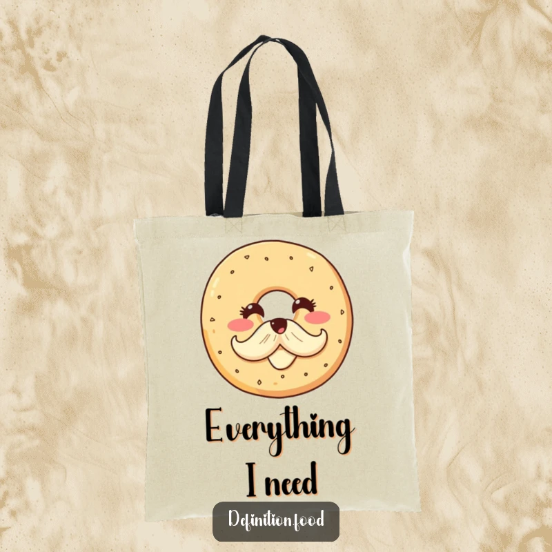 Funny tote bag with a smiling bagel character proudly sporting a cream cheese mustache, designed to carry your belongings with breakfast-inspired charm.